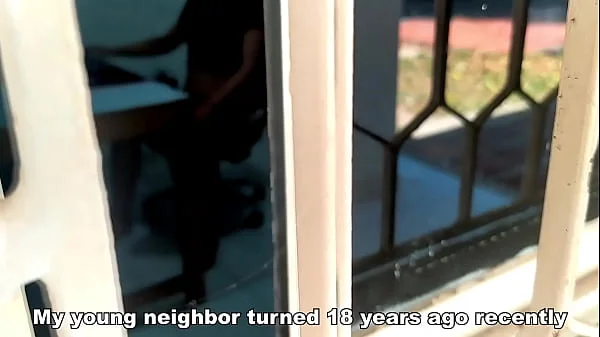 Catching my young neighbor through the window. My neighbor has just turned 18 and I discovered her masturbating while she watches porn on her computer. She watches video of threesomes being half-naked while she touches her pussy.