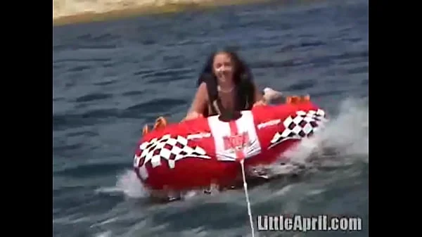 Sexy teen Little April playing with her snatch outdoors in rubber boat